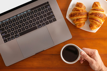 Home working enjoying a cup of coffee and a snack