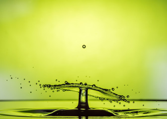 Water Drop Collisions Macro Photography with green background