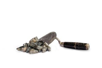 Stones used in conjunction with cement, including trowel, are used for separate construction on a white background.
