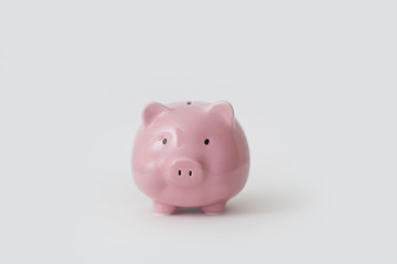 Close-up of pink piggy bank stands on white background