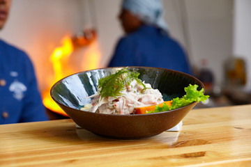 Peruvian ceviche made with raw fish cooked with lemon juice