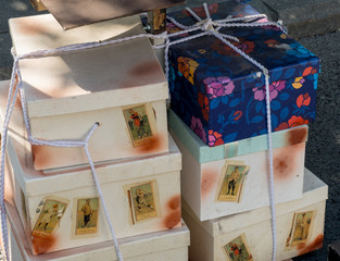 Bucharest, Romania, 1st of September 2019: vintage retro gift boxes one on top of another, colorful and simple, rope tied together during retro vintage event called "La pas pe Calea Victoriei 2019"