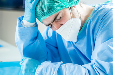 Portrait of an exhausted doctor in his office.