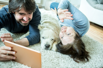 Young couple with dog at home