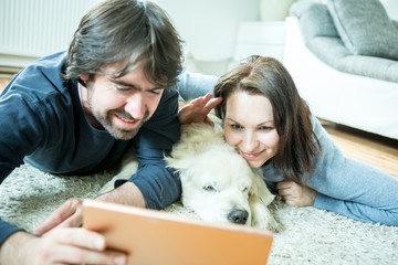 Young couple with dog at home