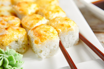 Baked rolls in white plate top view