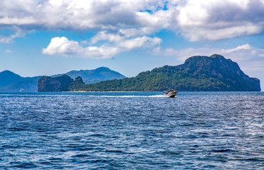 Pleasure boat on the waves of the Indian ocean near El Nido island. Palawan, Philippines