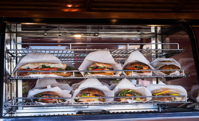 Sandwiches display during fast food festival outdoor event. Outside catering. Food Buffet Catering