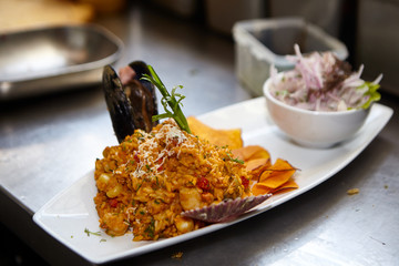Peruvian sea cuisine with rice fried octopus