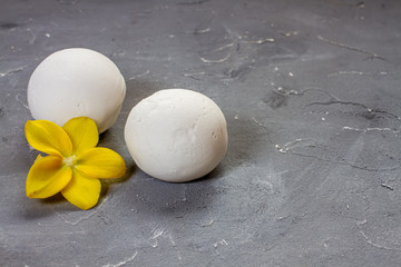 ice cream vanilla in a spoon and orchid flower