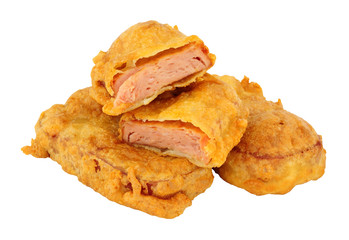 Batter covered fried spam luncheon meat fritters isolated on a white background