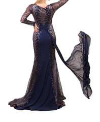 Beautiful woman dressed in evening gown over white background
