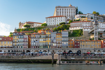 Portugal cityscape by the river with tourist (blurred face) hanging out - 346374228