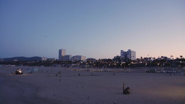 Handheld shot of Santa Monica Beach at twilight
