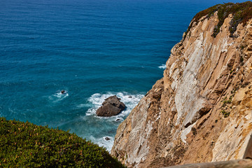 rocky landscape in the atlantic ocean. rocky cliff into the ocean portugal.
