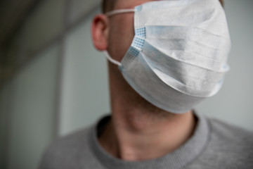 medical mask on a man’s face, closeup