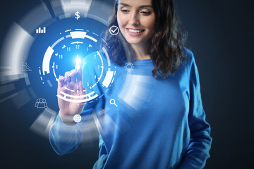 Woman with virtual clock on dark background. Time management concept