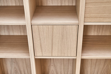 Obraz na płótnie Canvas Wooden bookshelves. Wooden bookcases and wall panels made of oak veneered MDF