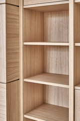 Wooden bookshelves. Wooden bookcases and wall panels made of oak veneered MDF