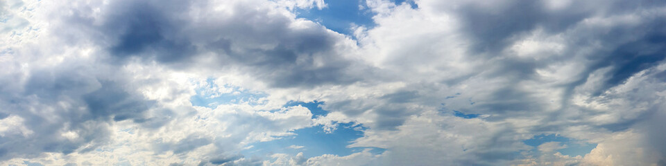 Naklejka na ściany i meble Blue sky panorama with storm cloud on a cloudy day. Beautiful 180 degree panoramic image.