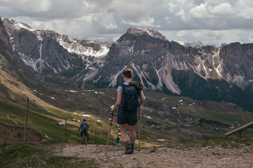 Fototapeta premium hiking in the mountains. tourist with backpack in the mountains. Dolomites, Italy