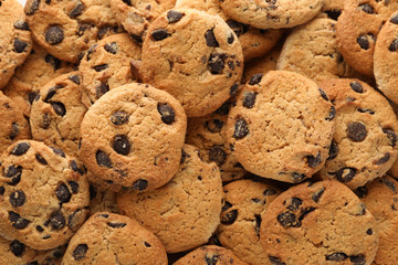 Chocolate chip cookies on whole background. Texture background