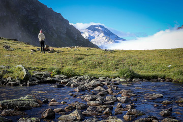 Mountain view with clouds and woman