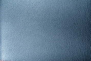 Faux leather texture in metallic blue. Artificial leather close-up