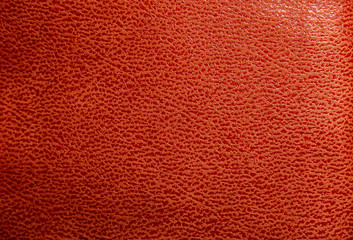 Orange faux leather. Faux leather texture close up with streaks