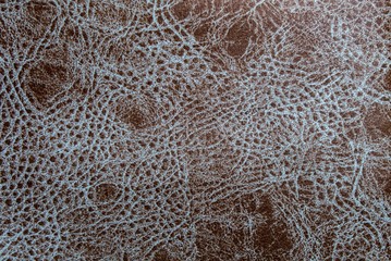 Brown faux leather with white streaks. Artificial leather texture