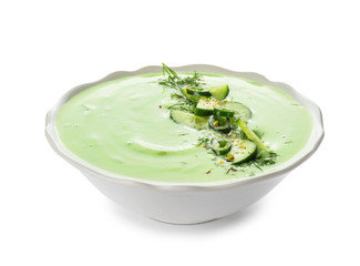 Bowl with cold cucumber soup on white background