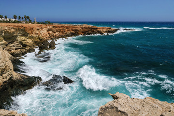 Fototapeta na wymiar Mediterranean Sea View. Strong wave near the rocks