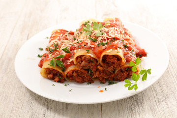 cannelloni with minced beef, tomato sauce and cheese
