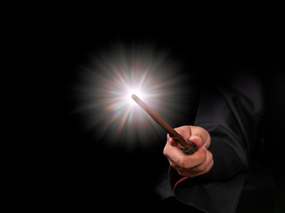 Magic wand with sparkle on black background, Miracle magical stick Wizard tool on black.
