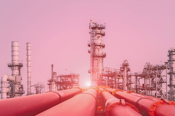 Pipe line connect in oil refinery with sunset.