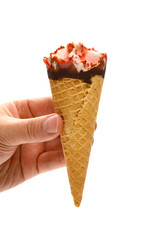 hand holding a fresh strawberry flavor ice cream cone on white with clipping path