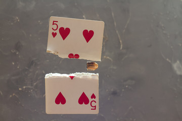 five worms piercing a card