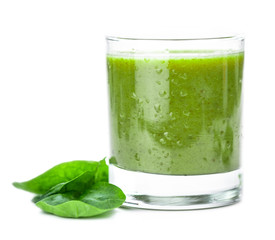 Homemade spinach smoothie isolated on white (close up; selective focus)