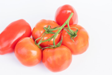 close up of ripe red tomatoes vegetable and ingredient for cooking in the kitchen, isolated on white background for text.