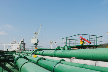 Green Pipe line system on Oil tanker ship Tubes running in the direction pipeline transportation is...