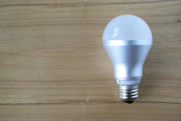 light bulb on a wooden background