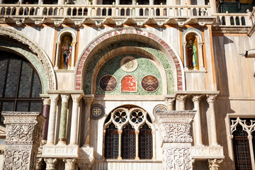 Close up. The Patriarchal Cathedral Basilica of Saint Mark is the iconic church of the Roman Catholic Archdiocese with towers, arches and angel figures, statues & a museum in Venice, Veneto, Italy