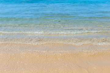 Fototapeta na wymiar Clea sea water waving and sand beach, summer season, clean beach, tropical nature