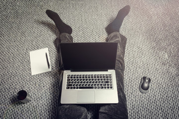 laptop notepad pen legs phone home work remotely comfort