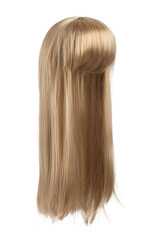Subject shot of a natural looking caramel blonde wig with bangs. The long wig with straight strands is isolated on the white background.