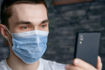 guy in medical mask on quarantine self-isolation
