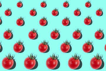 Ripe cherry tomatoes in a geometric order on a bright blue background