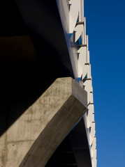 A fragment of a railway overpass in the rays of the sun.