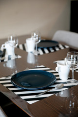 Beautiful dining table setup with blue plate