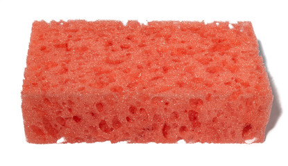 red porous sponge for washing dishes in the kitchen